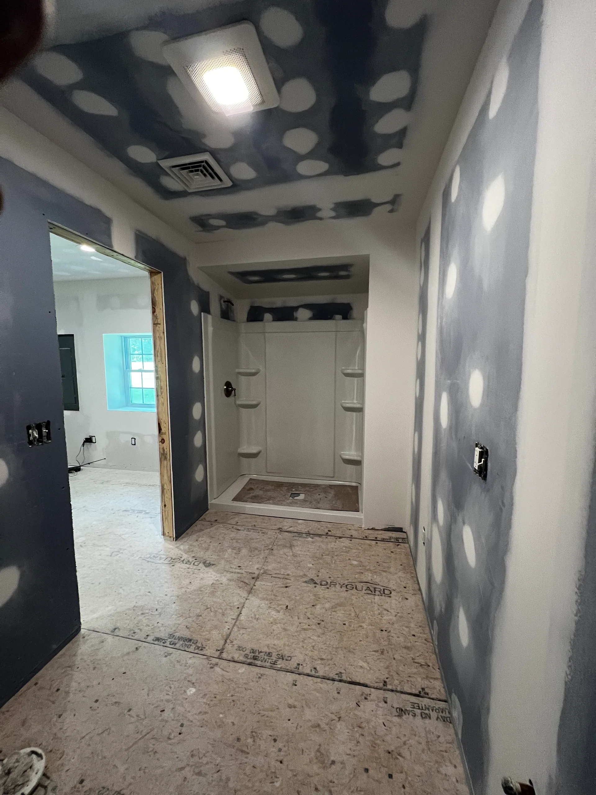 bathroom remodel taped drywall fiberglass shower insert dryguard subfloor silver