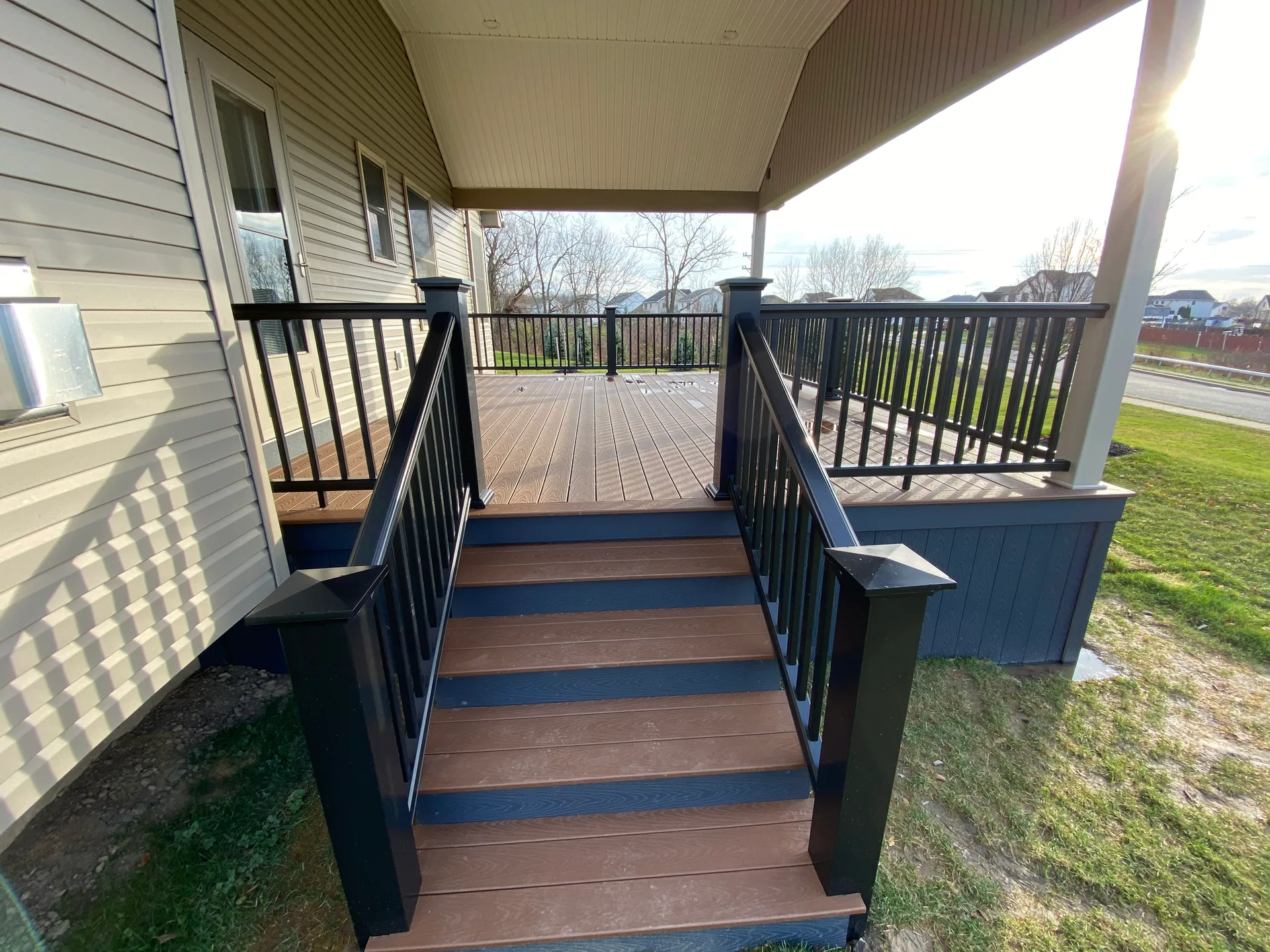 composite deck stairs black balusters blue risers covered deck silver springs ny