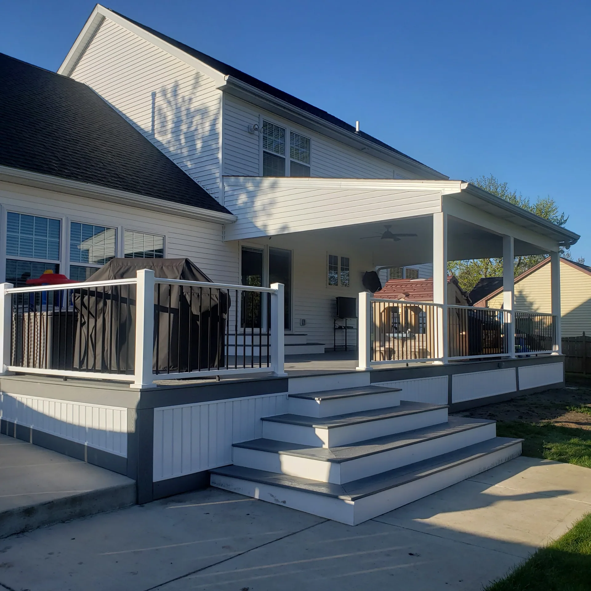covered composite deck gray decking white railing wide steps silver springs ny