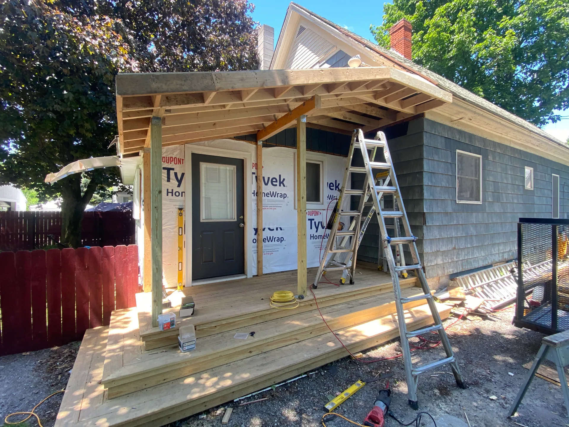 Porch Roofs Framed for Snow and Tied Into the House