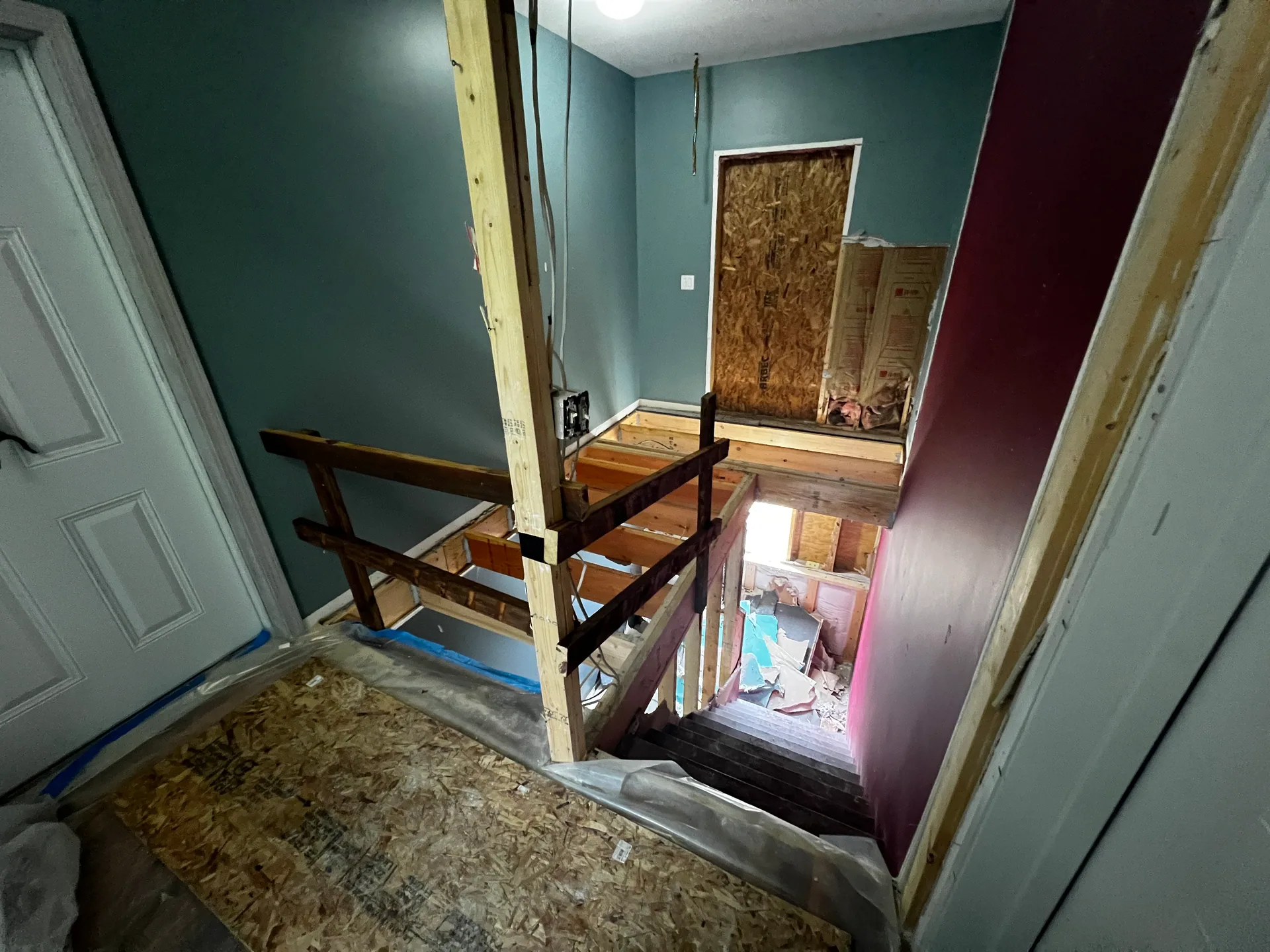 demolished stairwell open floor joists osb landing temporary railing lancaster n