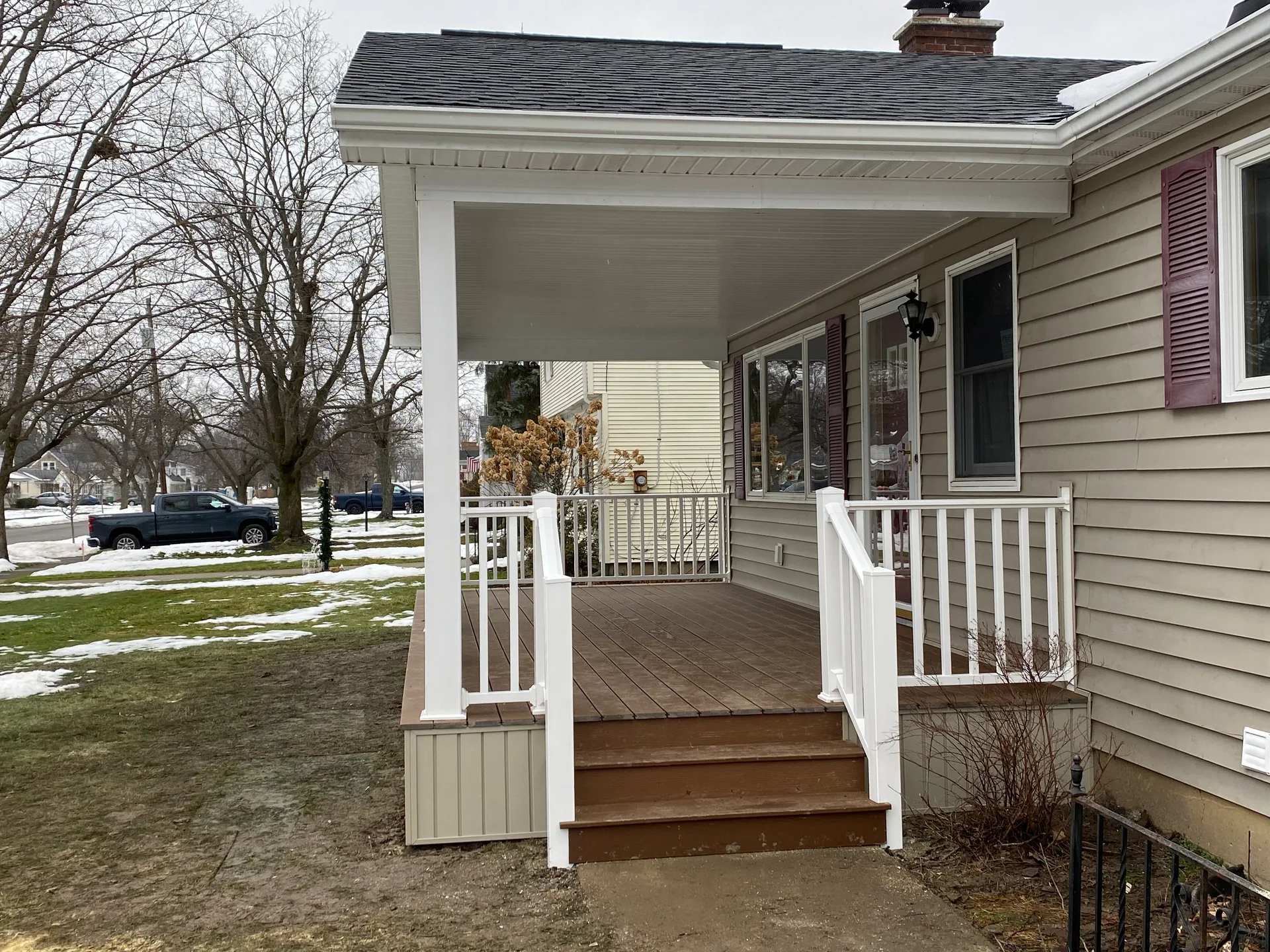 new front porch composite steps white railing tan siding silver springs ny