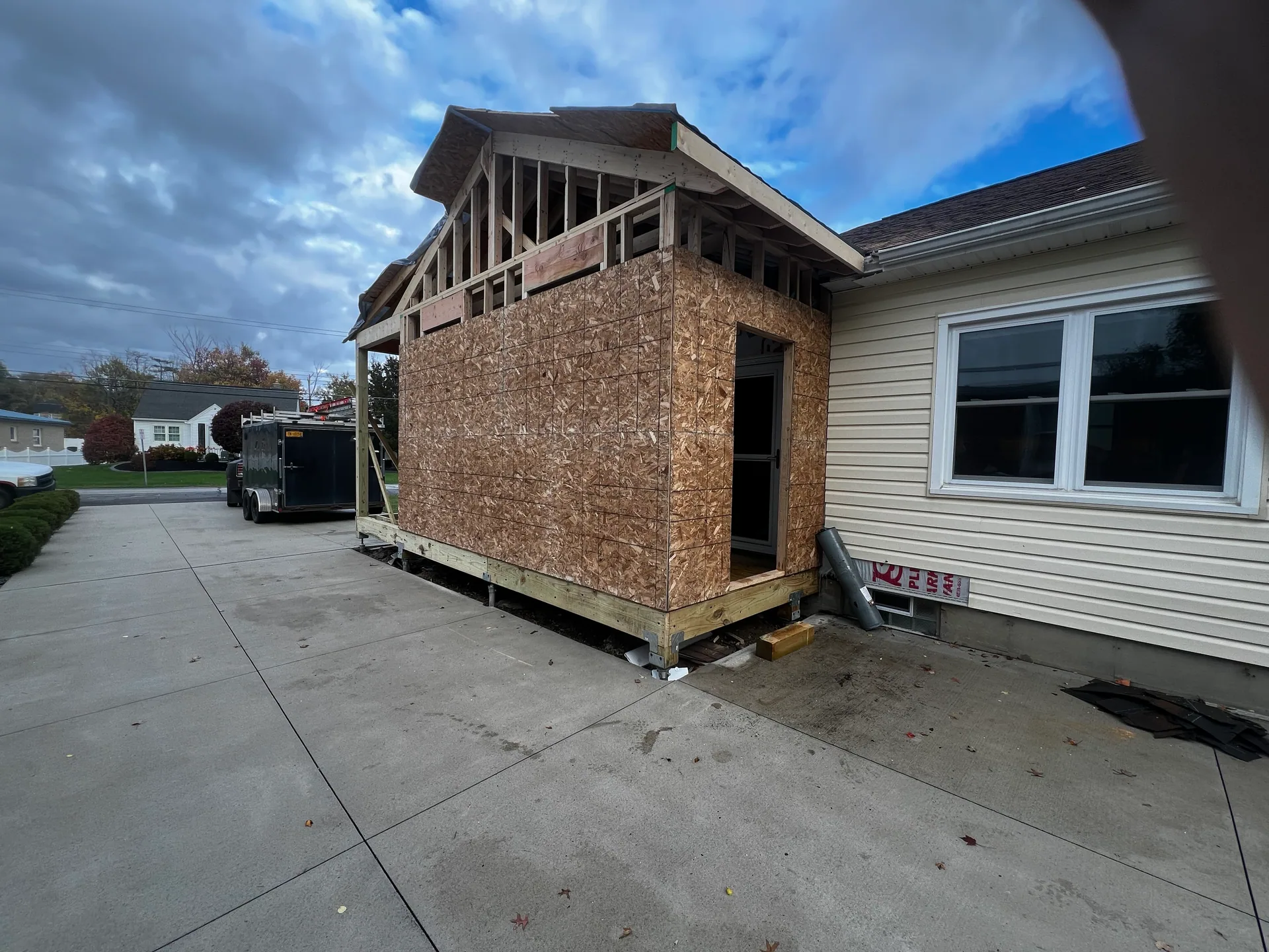 osb sheathed side addition gable framing concrete driveway trailer silver spring