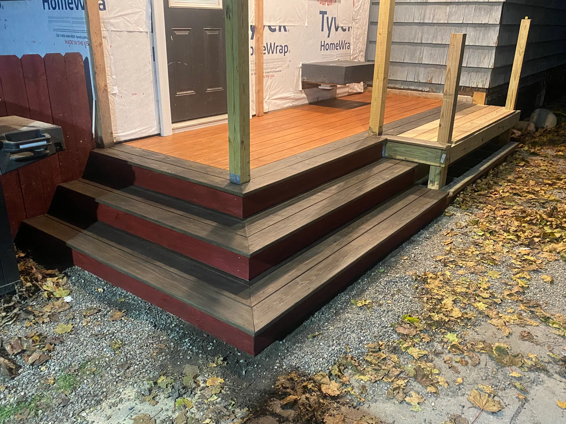 wraparound porch corner steps orange stained floor posts tyvek door western ny
